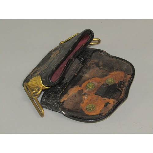 3 - A 19c Artillery officers black leather pouch, the flap with a brass field gun and having leaf moulde... 