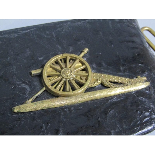 3 - A 19c Artillery officers black leather pouch, the flap with a brass field gun and having leaf moulde... 