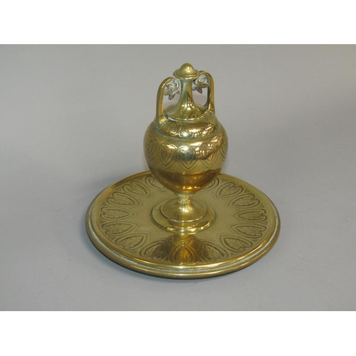 31 - A 19c gilt bronze inkwell of baluster form with a hinged two handled cover, supported on a circular ... 