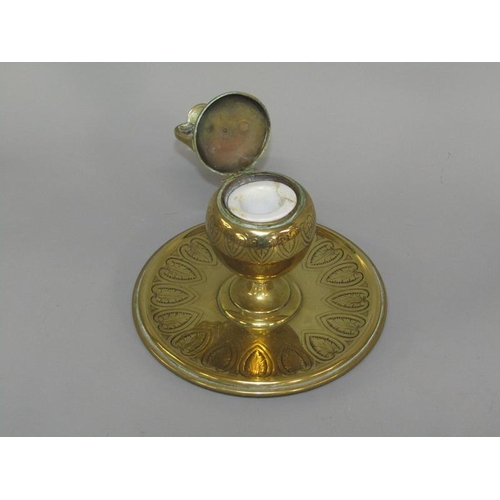 31 - A 19c gilt bronze inkwell of baluster form with a hinged two handled cover, supported on a circular ... 