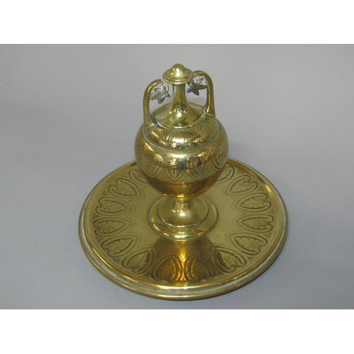 31 - A 19c gilt bronze inkwell of baluster form with a hinged two handled cover, supported on a circular ... 