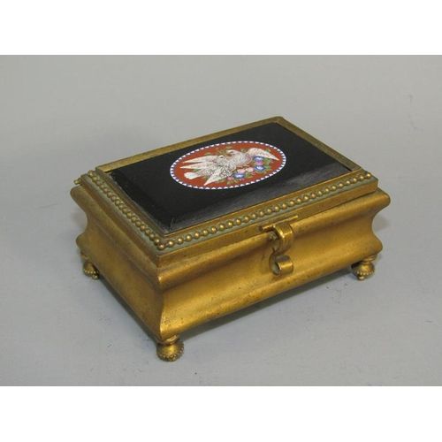 36 - A late 19c gilt metal casket of rectangular shaped form supported on four short beaded legs with a h... 