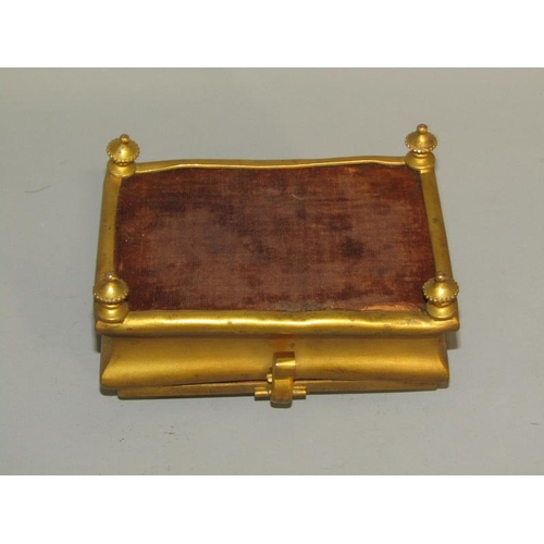 36 - A late 19c gilt metal casket of rectangular shaped form supported on four short beaded legs with a h... 