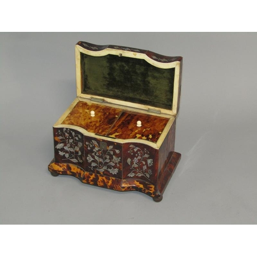 38 - A late Georgian tortoiseshell two compartment tea caddy of serpentine form, the front panels with mo... 