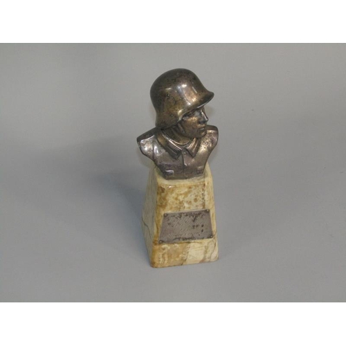 42 - A 1930's German presentation sculpture of a German Officer of the period, supported on a marble base... 