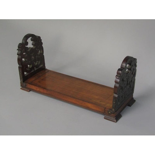 58 - A Victorian rosewood groove book slide with Royal Letters Patent to base, 53cm w open and having hin... 