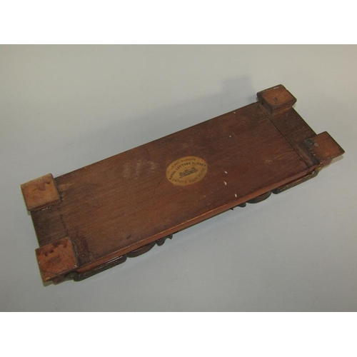 58 - A Victorian rosewood groove book slide with Royal Letters Patent to base, 53cm w open and having hin... 