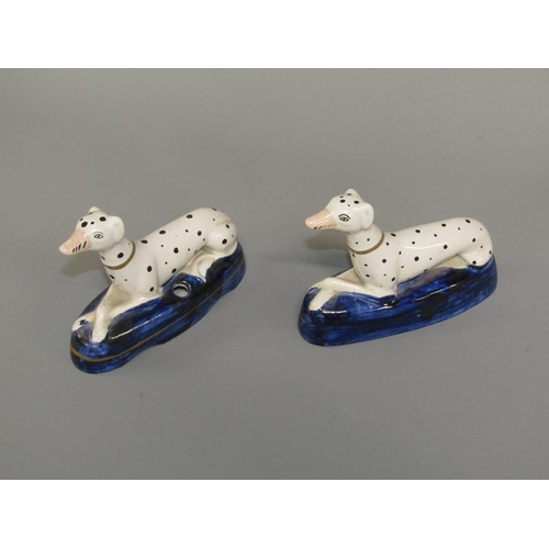 268 - A pair of 19c Staffordshire greyhound penholder figures on shaped cobalt blue bases, each 9.5cm h.