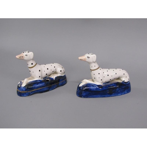 268 - A pair of 19c Staffordshire greyhound penholder figures on shaped cobalt blue bases, each 9.5cm h.