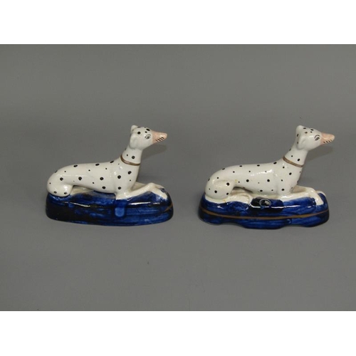 268 - A pair of 19c Staffordshire greyhound penholder figures on shaped cobalt blue bases, each 9.5cm h.