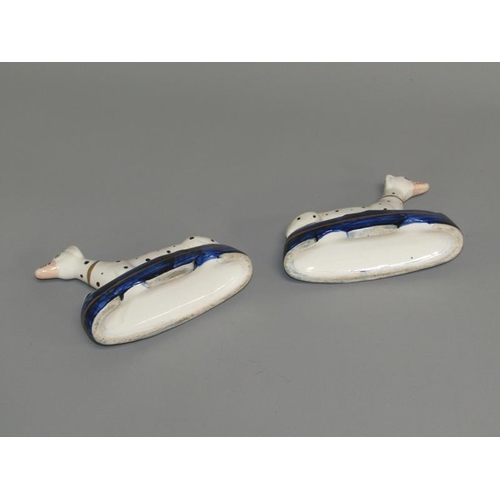 268 - A pair of 19c Staffordshire greyhound penholder figures on shaped cobalt blue bases, each 9.5cm h.