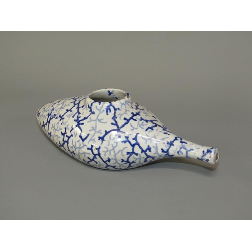 269 - A 19c oval blue and white feeding bottle with seaweed decoration, 19cm l.