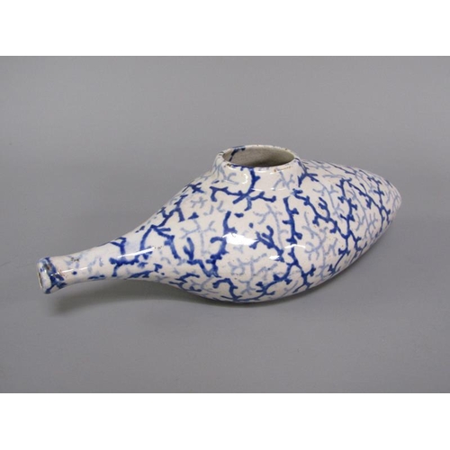 269 - A 19c oval blue and white feeding bottle with seaweed decoration, 19cm l.