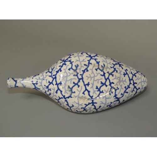 269 - A 19c oval blue and white feeding bottle with seaweed decoration, 19cm l.