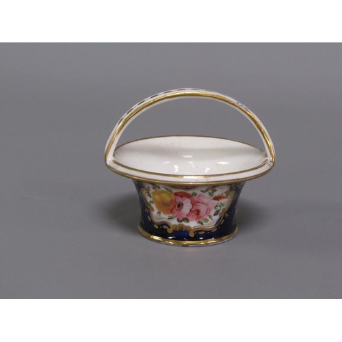 273 - An early 19c porcelain basket painted with floral reserves on a dark blue ground and having gilt lin... 