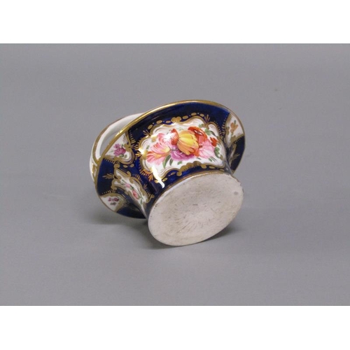 273 - An early 19c porcelain basket painted with floral reserves on a dark blue ground and having gilt lin... 