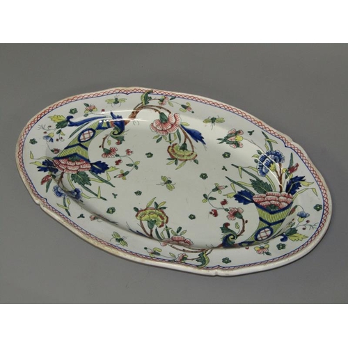 277 - A pair of oval polychrome painted dishes decorated in the Oriental style with a horn of plenty, flow... 