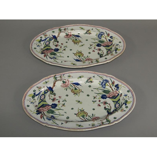 277 - A pair of oval polychrome painted dishes decorated in the Oriental style with a horn of plenty, flow... 