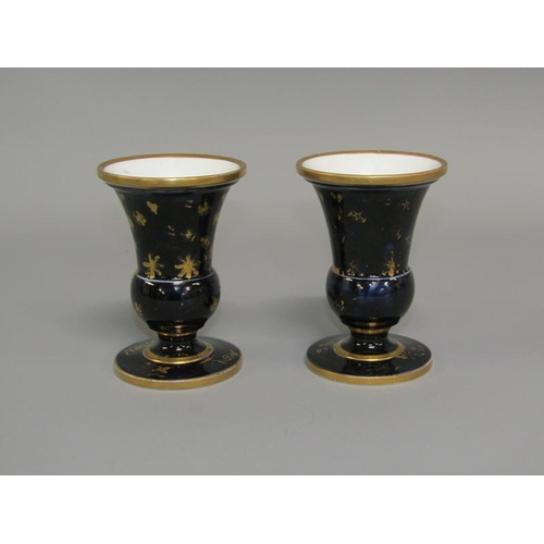 279 - A pair of early 19c Spode pedestal posy vases, hand painted with floral panels on a dark blue ground... 