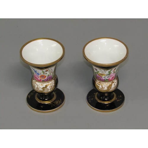 279 - A pair of early 19c Spode pedestal posy vases, hand painted with floral panels on a dark blue ground... 