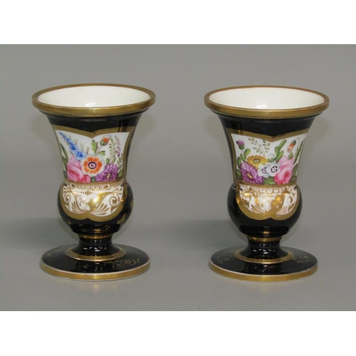 279 - A pair of early 19c Spode pedestal posy vases, hand painted with floral panels on a dark blue ground... 