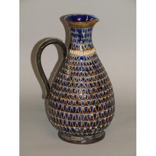 290 - A late 19c Doulton Lambeth stoneware jug with incised scale decoration and applied beadwork, 26cm h.