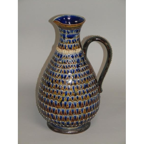 290 - A late 19c Doulton Lambeth stoneware jug with incised scale decoration and applied beadwork, 26cm h.