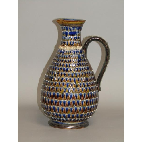 290 - A late 19c Doulton Lambeth stoneware jug with incised scale decoration and applied beadwork, 26cm h.