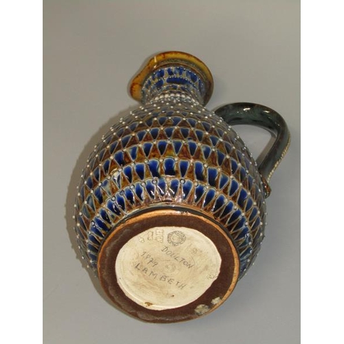 290 - A late 19c Doulton Lambeth stoneware jug with incised scale decoration and applied beadwork, 26cm h.