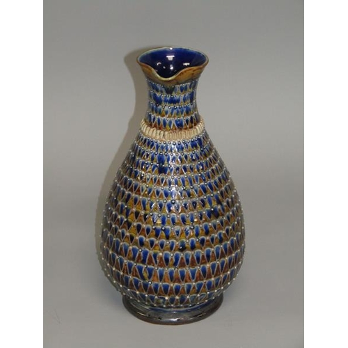 290 - A late 19c Doulton Lambeth stoneware jug with incised scale decoration and applied beadwork, 26cm h.