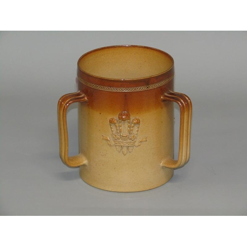 293 - A Doulton Lambeth stoneware three handled Prince of Wales tyg retailed by John Mortlock & Co, impres... 