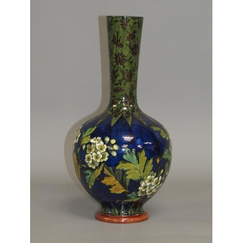 294 - A Doulton Lambeth faience vase by Alice Shelley of baluster form decorated with flowers and blossom,... 