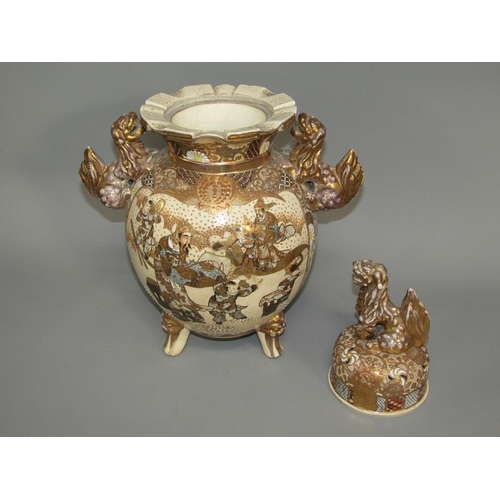 264 - A pair of Japanese satsuma two handled vases and covers decorated with figures and furnishings, each... 