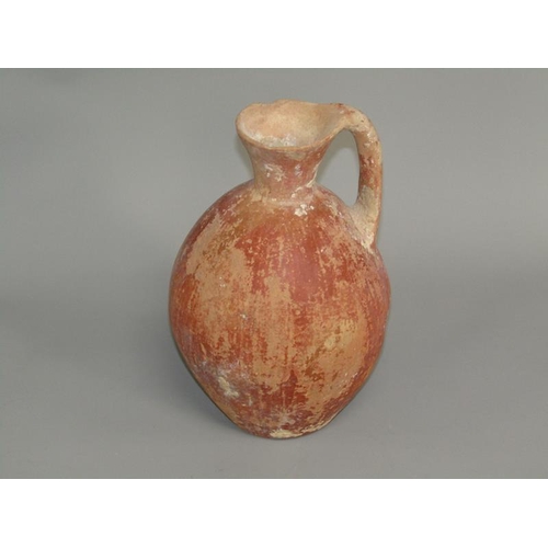 284 - A Abydos ware terracotta jug, early bronze age 3200/2800 BC, 26cm h.