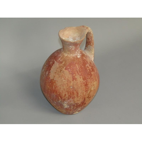 284 - A Abydos ware terracotta jug, early bronze age 3200/2800 BC, 26cm h.