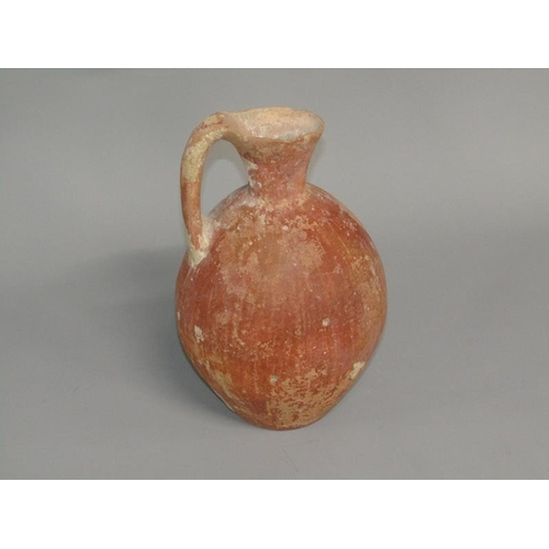 284 - A Abydos ware terracotta jug, early bronze age 3200/2800 BC, 26cm h.