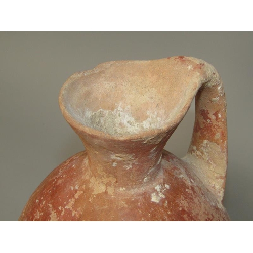 284 - A Abydos ware terracotta jug, early bronze age 3200/2800 BC, 26cm h.