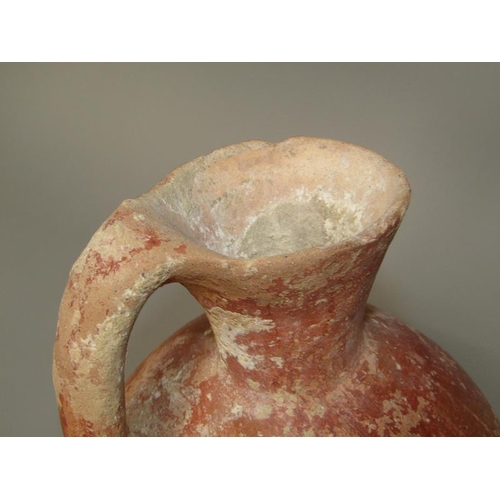 284 - A Abydos ware terracotta jug, early bronze age 3200/2800 BC, 26cm h.