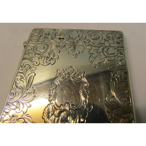 213 - A mid Victorian silver visiting card case chased with scrolling leaf and flowers, makers mark for Sa... 