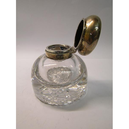 219 - A late Victorian large clear glass inkwell with silver mount and hinged domed cover, makers mark for... 