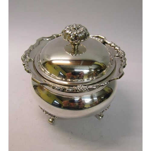 230 - A silver sucrier of bulbous form with a shaped upper spreading rim, with hinged domed cover having f... 