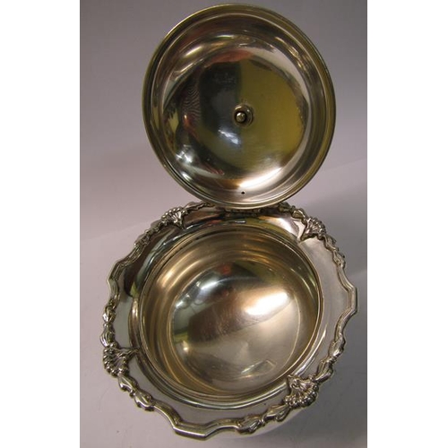 230 - A silver sucrier of bulbous form with a shaped upper spreading rim, with hinged domed cover having f... 