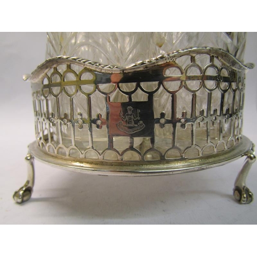 231 - A silver George III three bottle cruet stand with central carrying handle in a pierced circular fram... 