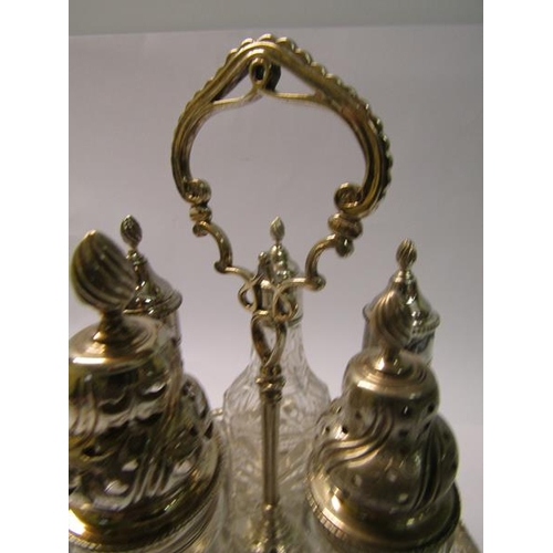 231 - A silver George III three bottle cruet stand with central carrying handle in a pierced circular fram... 