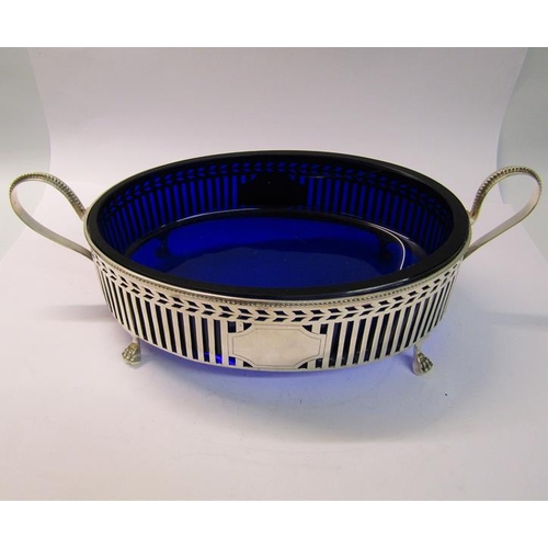 233 - A 19c Dutch silver two handled serving dish with a blue glass liner, the dish with a pierced outer f... 