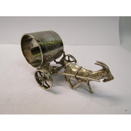 248 - An early 20c silver plated goat cart transporting a large napkin ring, 12cm w.