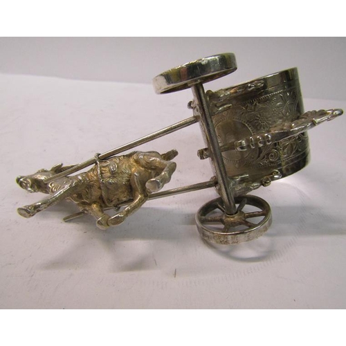 248 - An early 20c silver plated goat cart transporting a large napkin ring, 12cm w.