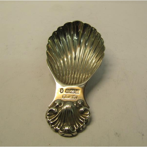 160 - A silver tea caddy spoon, shell shaped with shell embossed handle, makers mark for David Hollander &... 