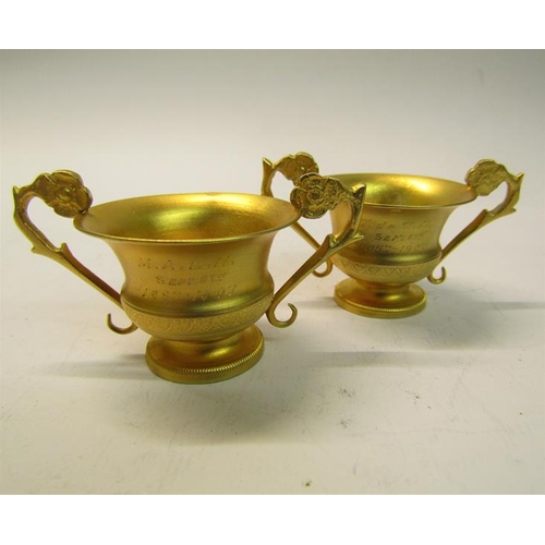 161 - A pair of 19c Italian silver gilt salt cellars of two handled form, Naples 1823/72, .883 grade, toge... 