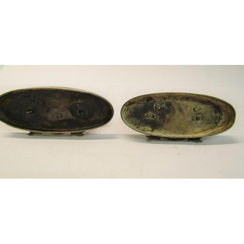 162 - A pair of Maltese silver menu card holders in the form of  boats, each with two oars supported on ov... 